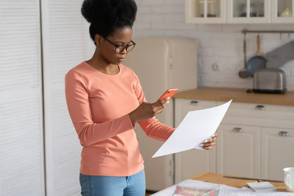 Millennial remote woman designer take photo of document on smartphone to send plan to client or boss — Stock Photo, Image