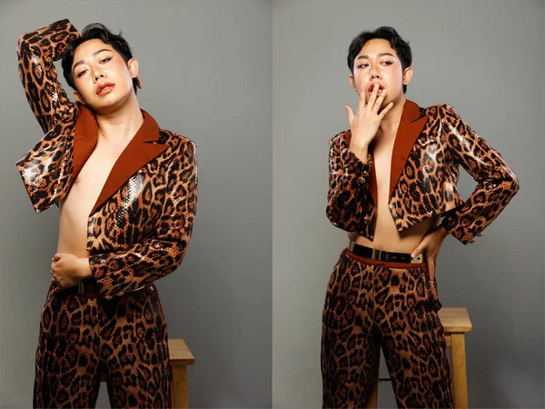 Half Body Portrait of 20s Asian LGBTQIA+ Gay man black hair wear blazzer tiger pattern dress. Male do Fashion poses half body over gray background isolated