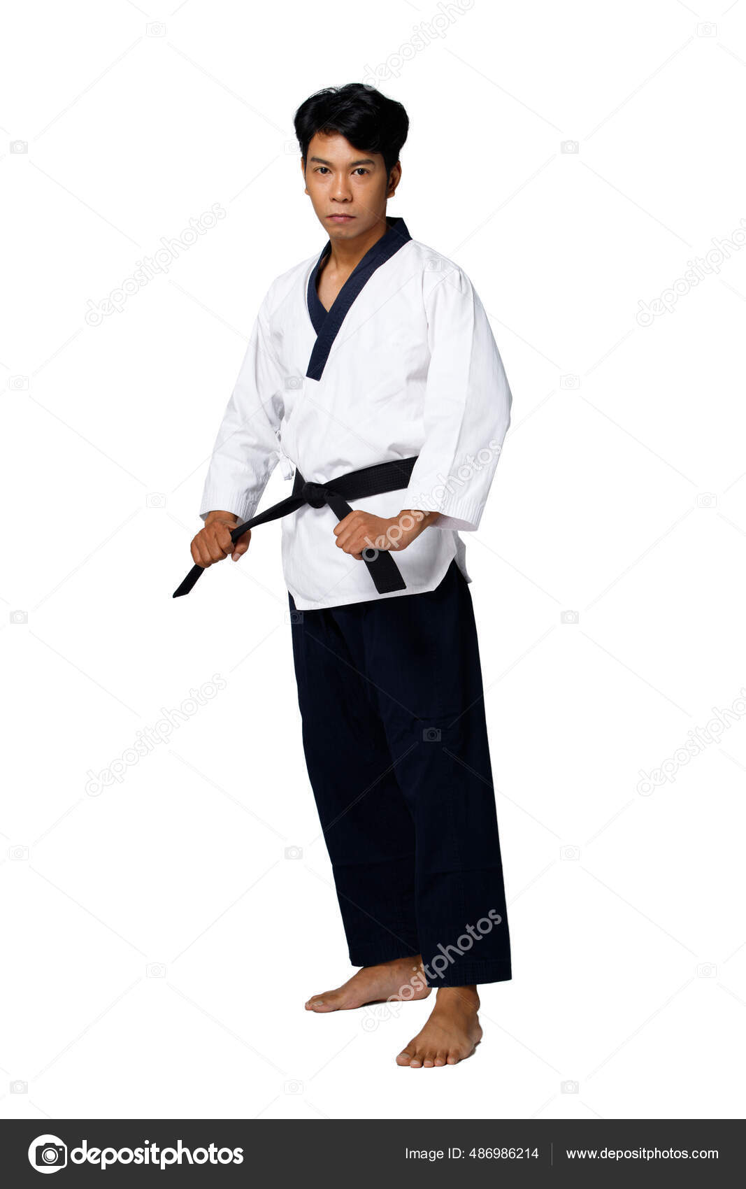 Wushu fighter poses with lance, martial arts. Man in black cloth poses with  blade Stock Photo - Alamy