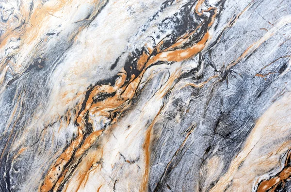 Quartz stone with gray and brown patterns. Background and texture of natural quartzite.