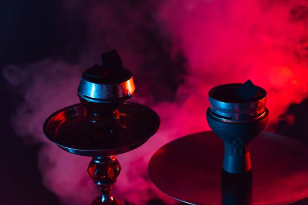 Hookah bowl and coals close up on a black background with smoke — Stock Photo, Image