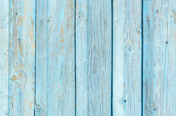 Textur eines alten Holzzaunes mit rissiger blauer Farbe — Stockfoto