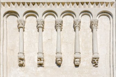 Fragment of wall of church with stone carvings  clipart
