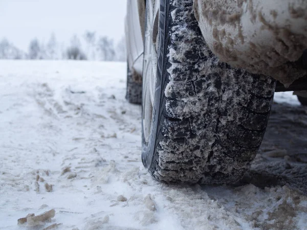 car on winter tires on a snow-covered road. tread on the tire.