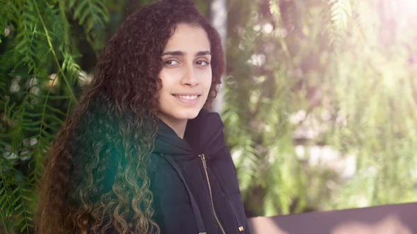 Young Brazilian Girl Sitting Park Bench Looking Camera Greenery — Stock Photo, Image