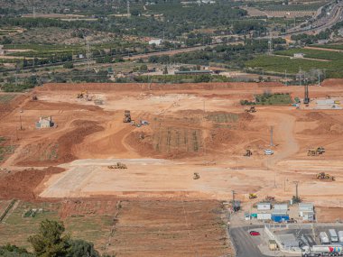 Land transformation from rural area to industrial site with visible environmental impact