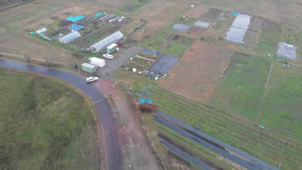 Small Scale Vegetable Farm with Greenhouse, Aerial Forward — Stock Video