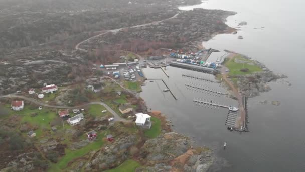 Rocky Landscape and Small Marina and Winterized Boats, Aerial Circling — Stock Video