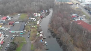 Boats and Sheds next to Canal in Industrial Area, Aerial