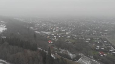View of Vast Villa Neighborhood Next to Rural Forest. White Fog Day, Aerial