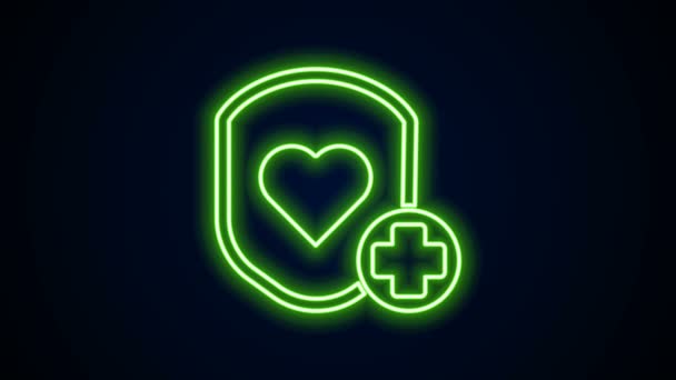 Zářící neonová čára Štít a srdeční frekvence ikona izolované na černém pozadí. Koncept ochrany zdraví. Zdravotní péče. Grafická animace pohybu videa 4K — Stock video