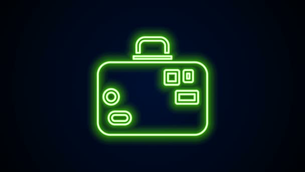 Świecąca neonowa linia Walizka na ikonę podróży izolowana na czarnym tle. Podróżujący znak bagażu. Ikona bagażu podróżnych. 4K Animacja graficzna ruchu wideo — Wideo stockowe