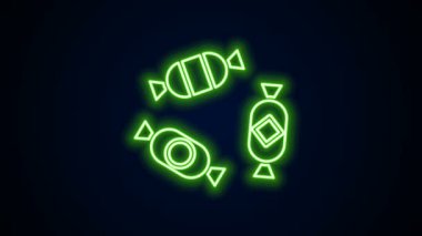 Parlayan neon hattı Candy simgesi siyah arkaplanda izole edildi. 4K Video hareketli grafik canlandırması