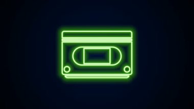 Parlayan neon hattı VHS video kaset ikonu siyah arkaplanda izole edildi. 4K Video hareketli grafik canlandırması