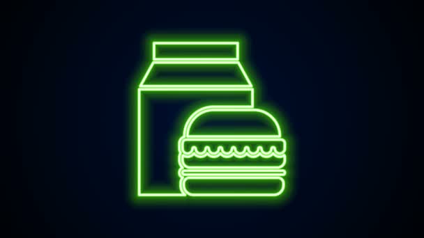 Leuchtende Leuchtschrift Online-Bestellung und Burger-Lieferung-Symbol isoliert auf schwarzem Hintergrund. 4K Video Motion Grafik Animation — Stockvideo