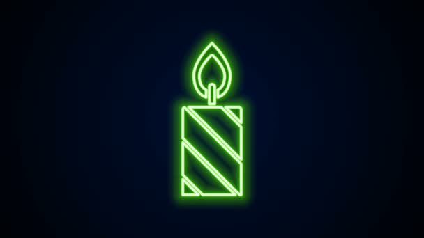 Glowing neon line Burning candle in candlestick icon isolated on black background. Cylindrical candle stick with burning flame. 4K Video motion graphic animation — Stock Video