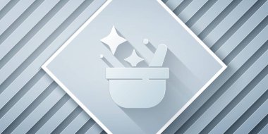 Kağıt kesiği cadı kazanı simgesi gri arkaplanda izole edilmiş. Mutlu Cadılar Bayramı Partisi. Kağıt sanatı tarzı. Vektör.