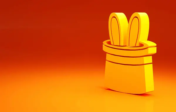 Chapéu mágico amarelo e ícone de orelhas de coelho isolado no fundo laranja. Truque mágico. Conceito de entretenimento misterioso. Conceito de minimalismo. 3D ilustração 3D render — Fotografia de Stock