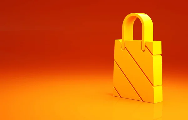 Icona della shopping bag di carta natalizia gialla isolata su sfondo arancione. Un cartello. Buon Natale e felice anno nuovo. Concetto minimalista. Illustrazione 3d rendering 3D — Foto Stock