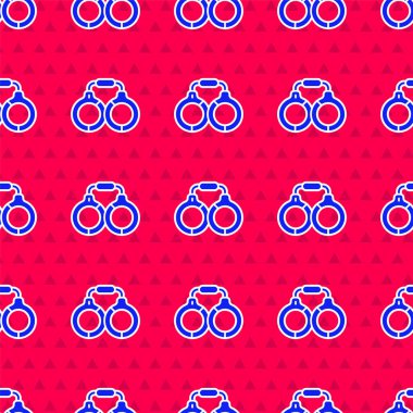 Mavi kelepçe simgesi kırmızı arka planda izole edilmiş. Vektör.