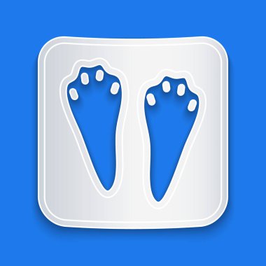 Kağıt kesiği Tavşan ve Tavşan pençesi ayak izi ikonu mavi arkaplanda izole edilmiş. Kağıt sanatı tarzı. Vektör.