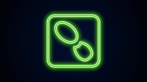 Glowing neon line Human footprints shoes icon isolated on black background. Shoes sole. 4K Video motion graphic animation — Stock Video