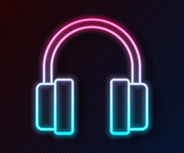 Parlayan neon hattı kulaklık simgesi siyah arkaplanda izole edildi. Kulaklıklar. Müzik, hizmet, iletişim ve operatör konsepti. Vektör.