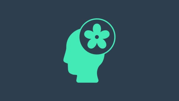 Turquoise Human head with flower inside icon isolated on blue background. 4K Video motion graphic animation — 비디오