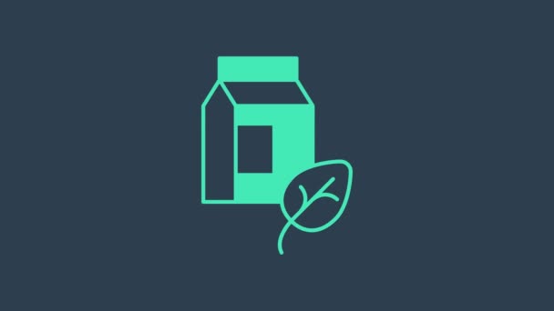 Значок бирюзового веганского молока выделен на синем фоне. Вегетарианский продукт. Видеографическая анимация 4K — стоковое видео