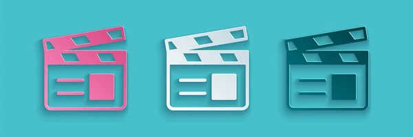 Papiergeschnittenes Movie clapper icon isoliert auf blauem Hintergrund. Filmklappbrett. Klappschild. Kinoproduktion oder Medienindustrie. Papierkunst. Vektor — Stockvektor