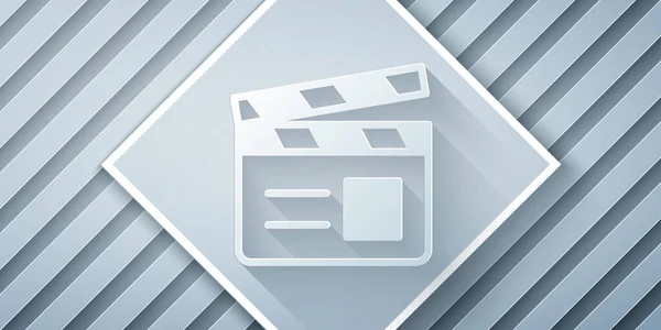 Papiergeschnittenes Movie clapper icon isoliert auf grauem Hintergrund. Filmklappbrett. Klappschild. Kinoproduktion oder Medienindustrie. Papierkunst. Vektor — Stockvektor