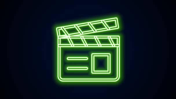 Žhnoucí neonová čára Ikona tleskače filmu izolovaná na černém pozadí. Filmová tabule. Nápis Clapperboard. Filmová produkce nebo mediální průmysl. Grafická animace pohybu videa 4K — Stock video