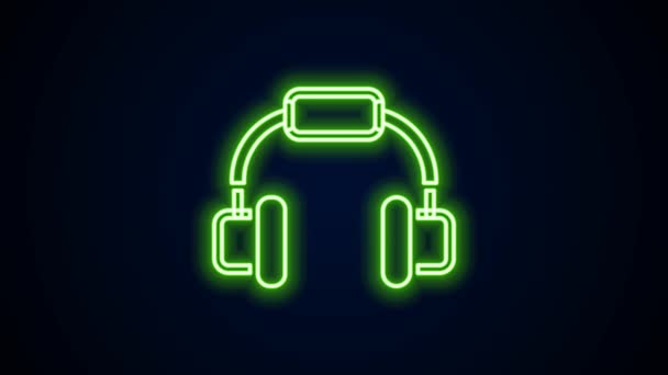 Glowing neon line Headphones icon isolated on black background. Earphones. Concept for listening to music, service, communication and operator. 4K Video motion graphic animation — Stock Video