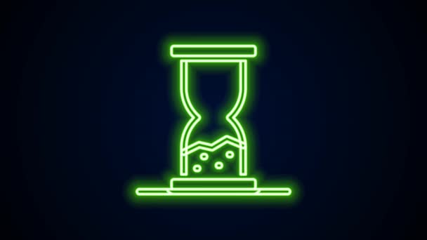 Glowing neon line Old hourglass with flowing sand icon isolated on black background. Sand clock sign. Business and time management concept. 4K Video motion graphic animation — Stock Video