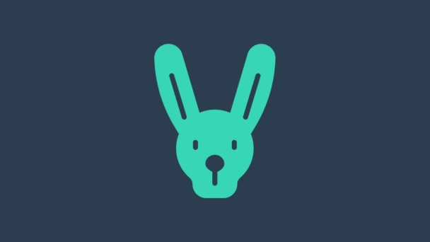 Turquoise Rabbit with ears icon isolated on blue background. Magic trick. Mystery entertainment concept. 4K Video motion graphic animation — Stock Video