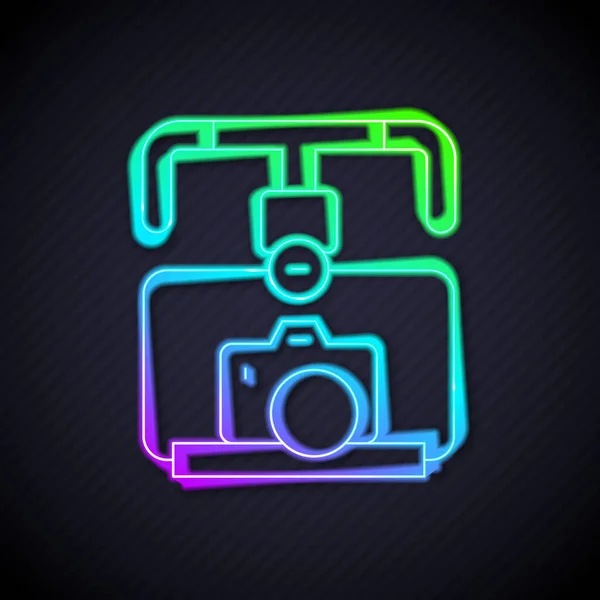 Glowing neon line Gimbal stabilizer with DSLR camera icon isolated on black background. Vector — Stock Vector