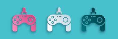 Kağıt kesiği Gamepad simgesi mavi arkaplanda izole edildi. Oyun kontrolörü. Kağıt sanatı tarzı. Vektör