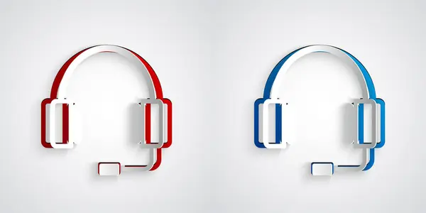 Papiergeschnittene Kopfhörer Ikone isoliert auf grauem Hintergrund. Kopfhörer. Konzept zum Hören von Musik, Service, Kommunikation und Bedienung. Papierkunst. Vektor — Stockvektor