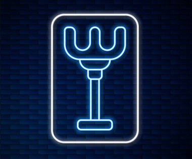 Glowing neon line Rake toy icon isolated on brick wall background. Children toy for beach games.  Vector