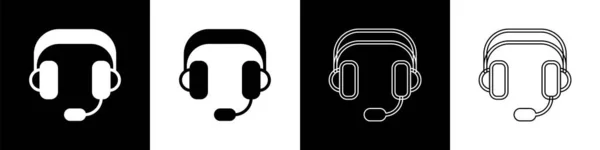 Ställ hörlurar ikon isolerad på svart och vit bakgrund. Hörlurar. Koncept för att lyssna på musik, service, kommunikation och operatör. Vektor — Stock vektor