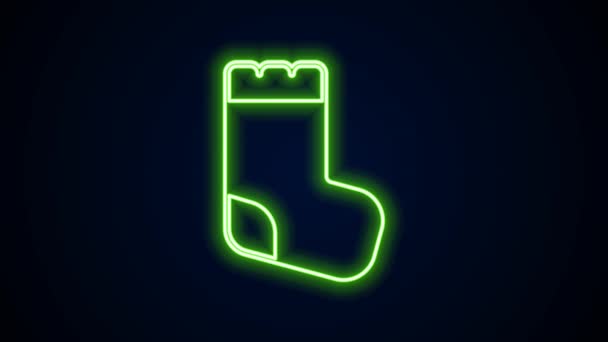 Gloeiende neon lijn Baby sokken kleding pictogram geïsoleerd op zwarte achtergrond. 4K Video motion grafische animatie — Stockvideo