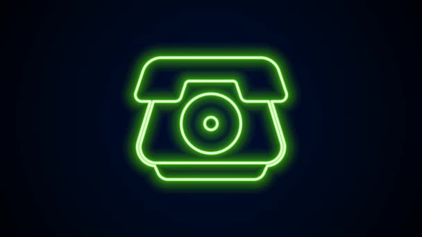 Icono de teléfono de línea de neón brillante aislado sobre fondo negro. Señal telefónica. Animación gráfica de vídeo 4K — Vídeo de stock