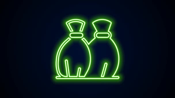 Glowing neon line Garbage bag icon isolated on black background. 4K Video motion graphic animation — Stock Video