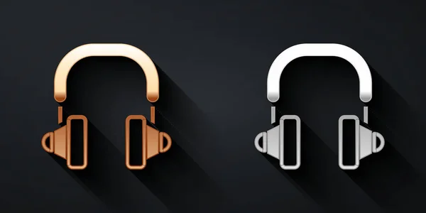 Gold- und silbernes Kopfhörer-Symbol isoliert auf schwarzem Hintergrund. Kopfhörer. Konzept zum Hören von Musik, Service, Kommunikation und Bedienung. Langer Schatten. Vektor — Stockvektor