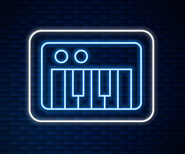 Светящаяся неоновая линия Значок музыкального синтезатора выделен на фоне кирпичной стены. Электронное пианино Вектор — стоковый вектор