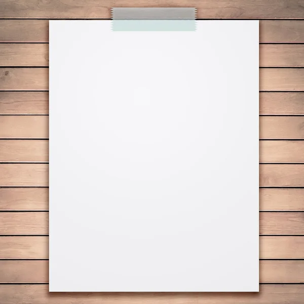 Empty white paper sheet stick on wood texture background. — Stock Photo, Image