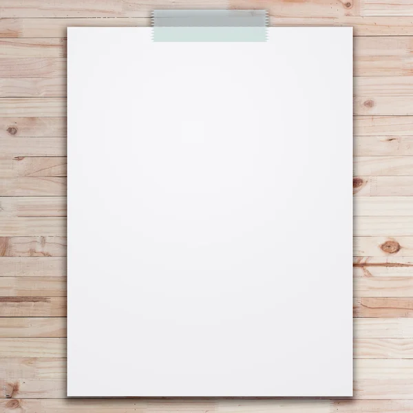 Empty white paper sheet stick on wood texture background. — Stock Photo, Image