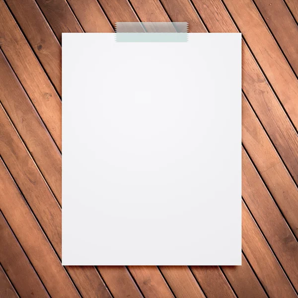 Empty white paper sheet stick on wood texture background. — Stock Photo, Image