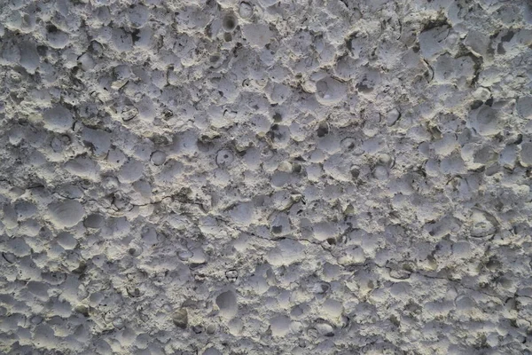 rocky surface, gray limestone, porous surface