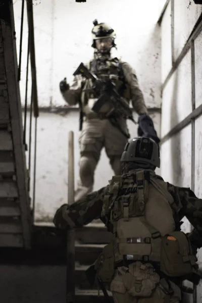 two guys in american military uniform stand on the stairs, airsoft sports game, military forces simulation